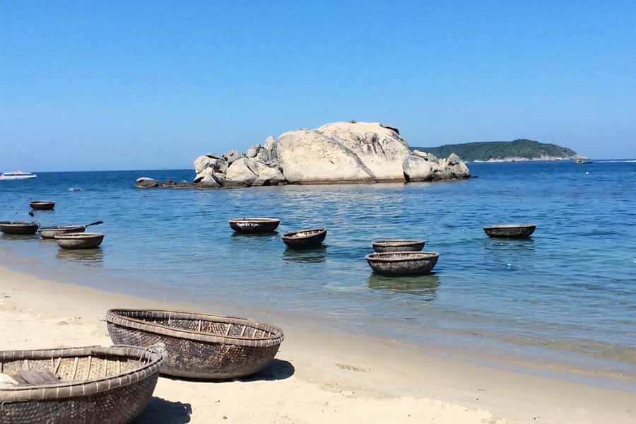 Cham Island Tour: Snorkeling & Spa from Da Nang/Hoi An - Entering the Cham Islands: pagoda, well, museum, and market time
