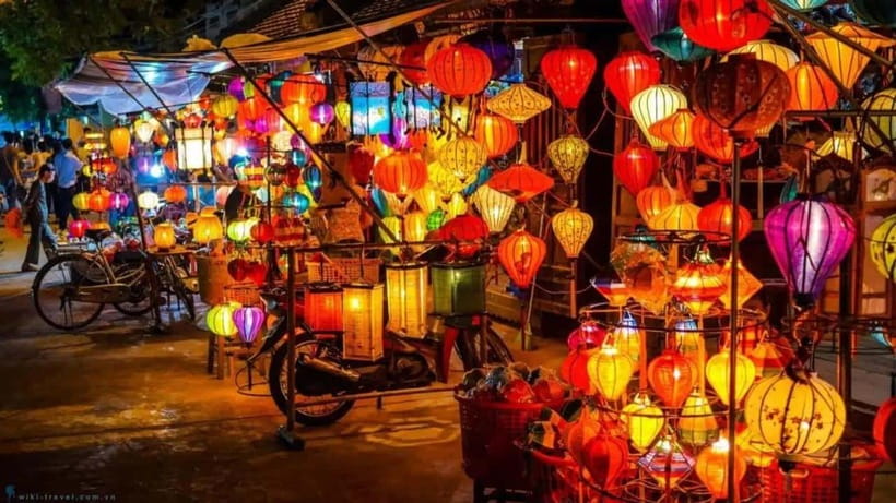 From Hoi An/Da Nang: Hoi An City Tour & Lanterns Release - The first stop: Hoi An Market and tailor-shop culture