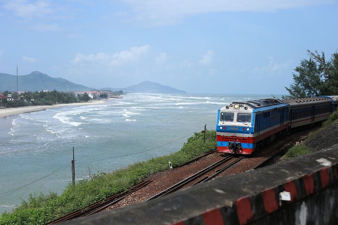 Hai Van Pass Adventure - Private Car Tour From Hoi An & Da Nang - Lang Co Beach lunch: white sand, turquoise water, and trains in the mix