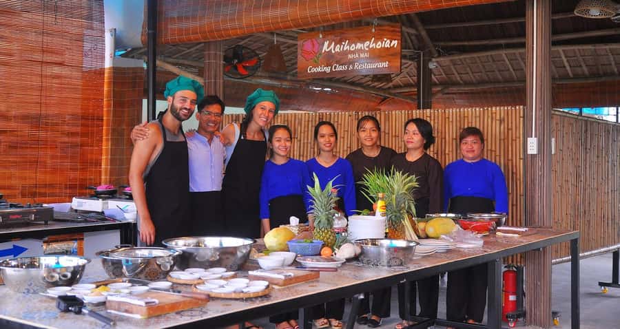 Hoi An Cooking Class With Market and Bamboo Basket Boat Tour - Arriving at the cooking school: gardens, tools, and a welcome drink