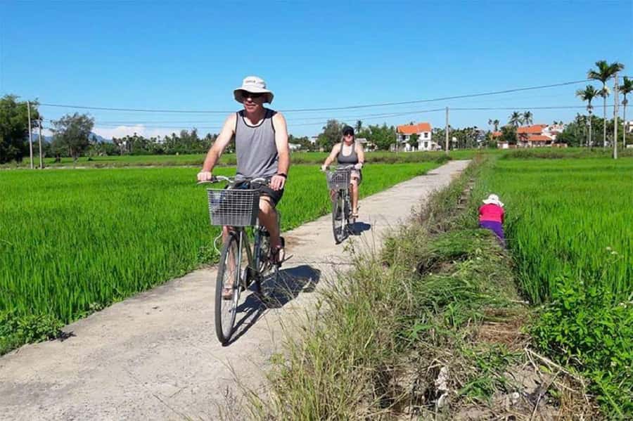 Hoi An: Countryside Bicycle Tour with Farm, Basket Boat Ride - Paddle the bamboo basket boat through coconut-palm waterways