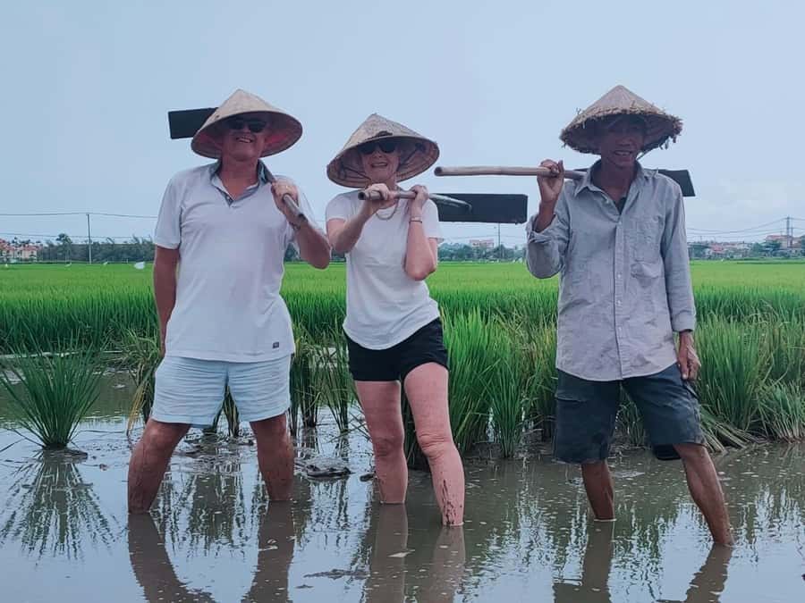 Hoi An: Countryside by Cycling, Buffalo Riding & Do Farming - Stopping to meet people: fishing village conversations that make the day connect