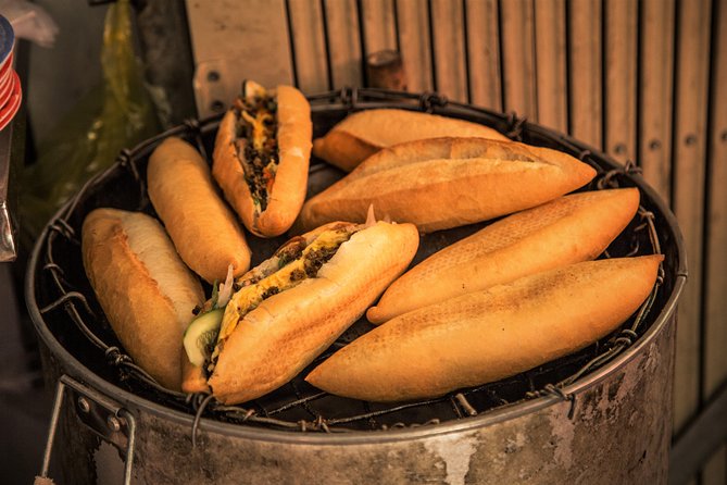 Private Hoi An Evening Food Tastings Tour by Bike - Stop 3: Cam Nam Island for banh xeo and Hoi An BBQ