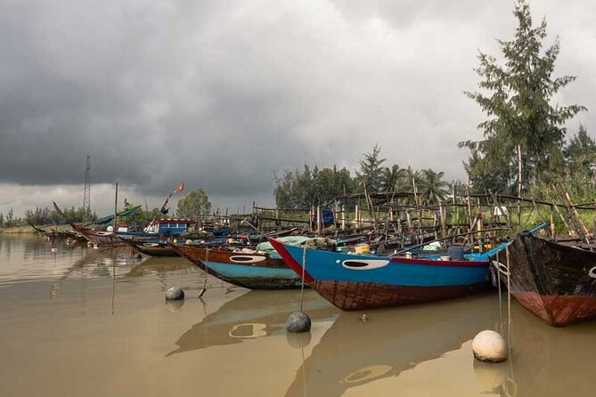 Private Hoi An River Life Photo Tour - Entering the river scene: boats, nets, and real morning motion